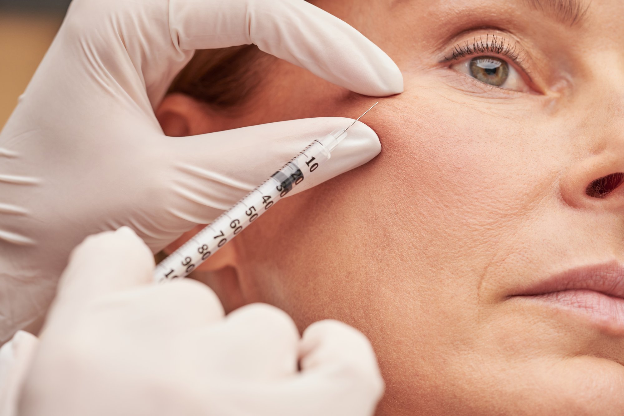 anti-aging-cosmetology-close-up-caucasian-mature-woman-getting-cosmetic-injection-her-cheek